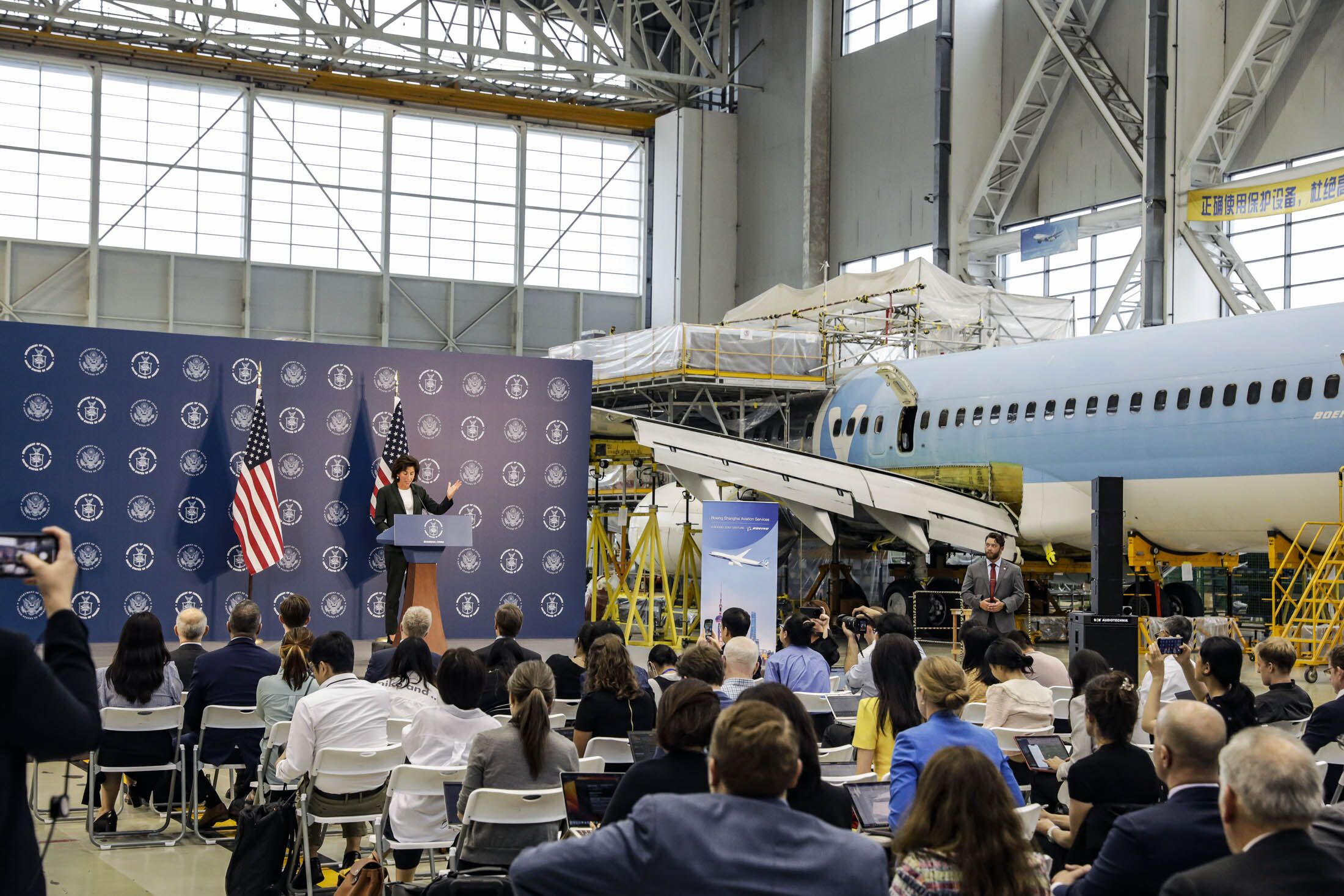 Gina Raimondo at a news conference in a Boeing Co. aircraft hangar in Shanghai on Aug. 30. Photographer: Qilai Shen/Qilai Shen/Bloomberg